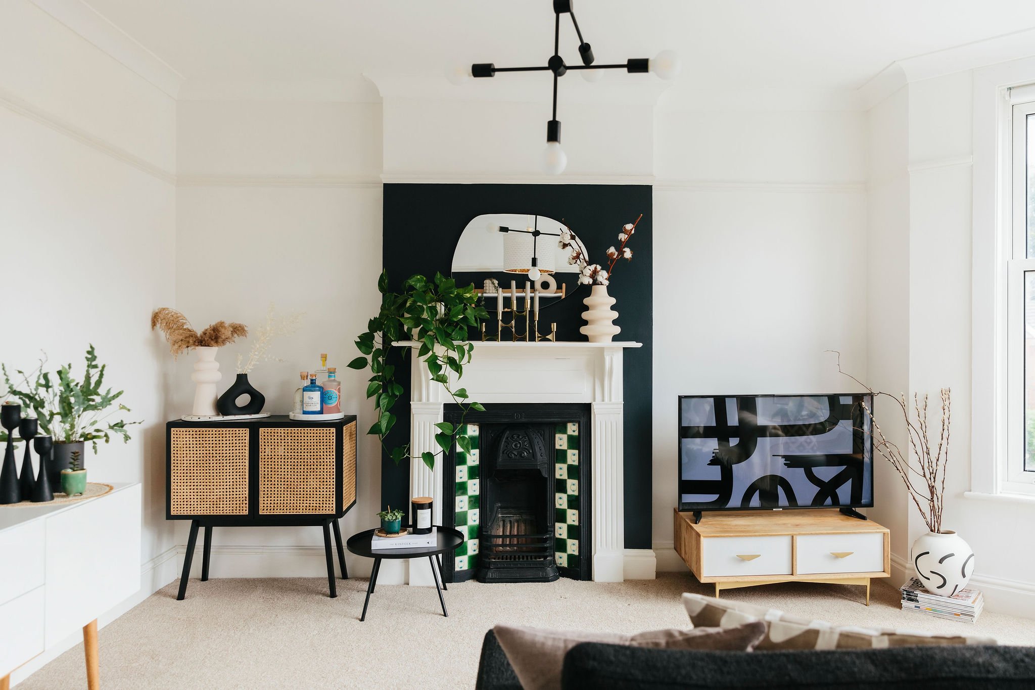 Living room with fireplace and statement tiles