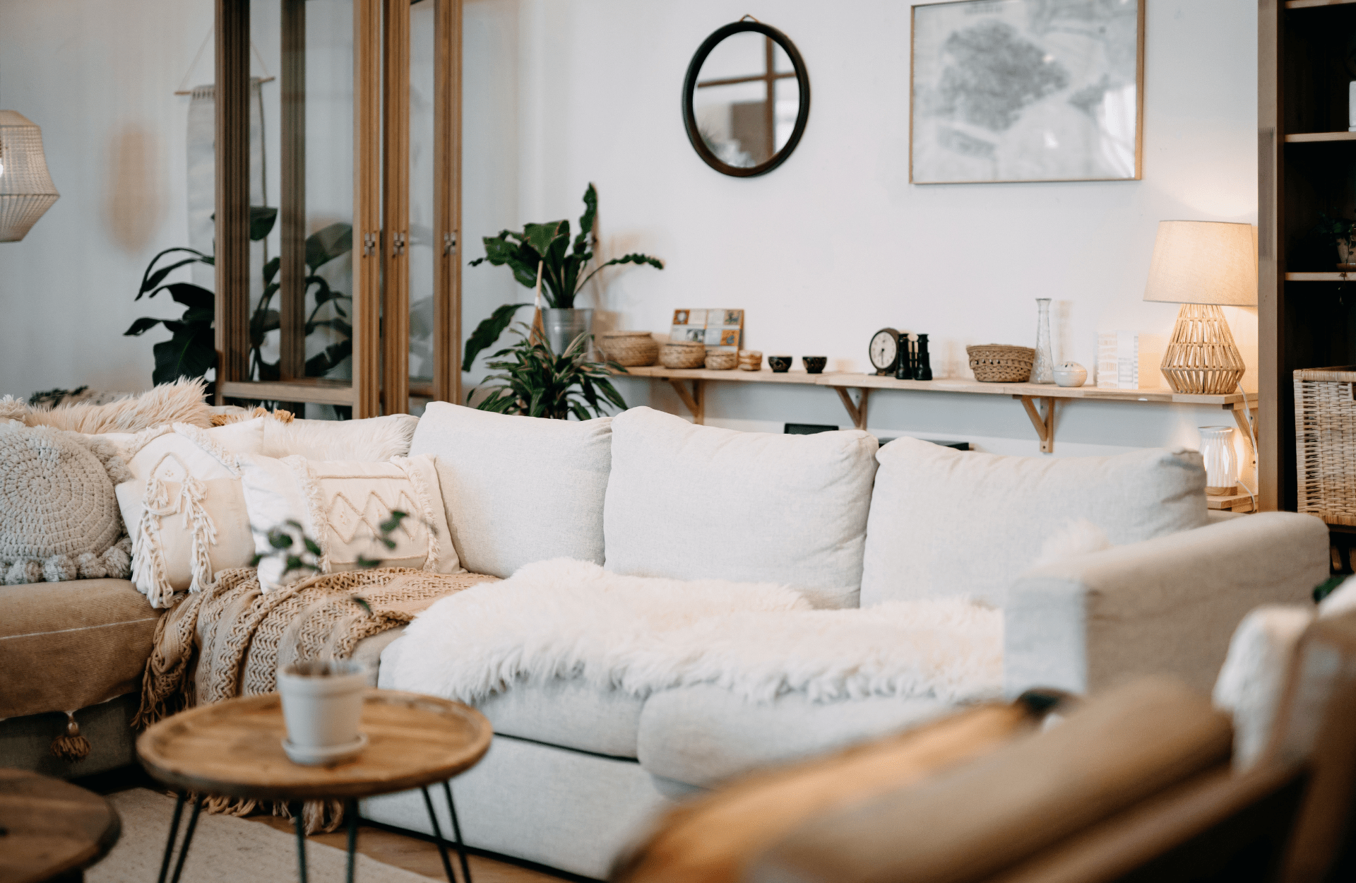 Cosy sofa with different texture blankets and pillows
