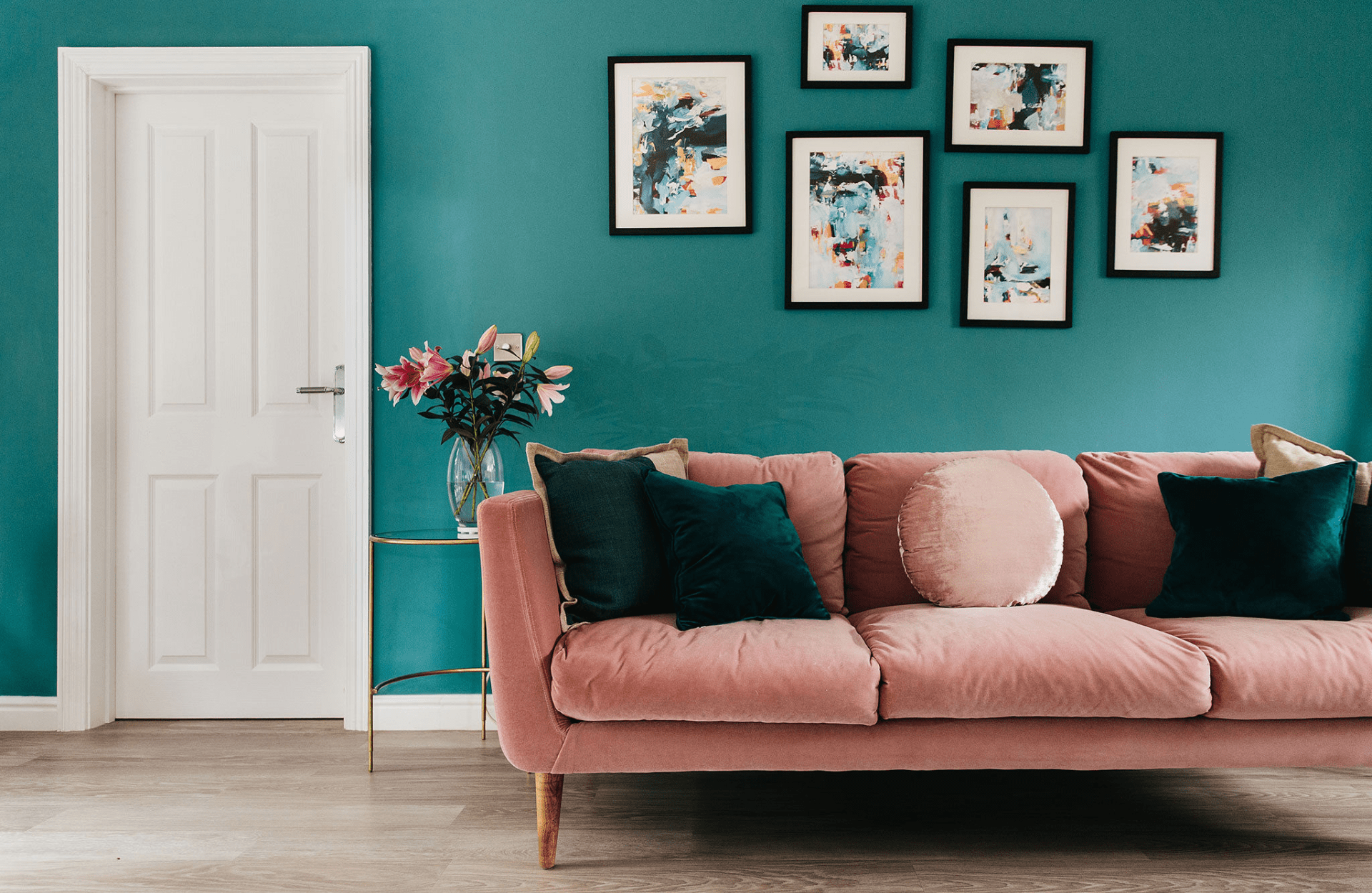 Blue wall with pink sofa